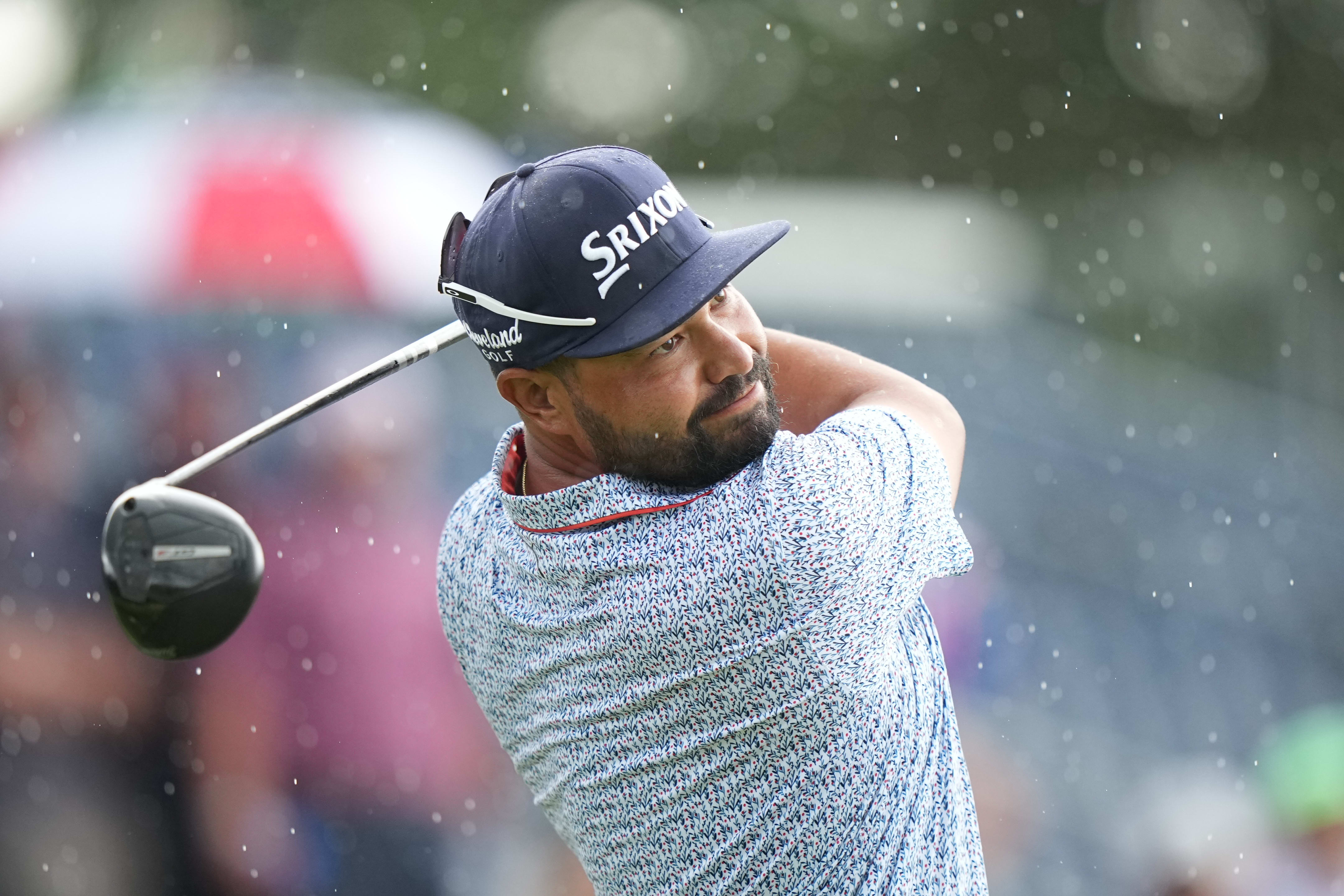 J.J. Spaun hits a shot in the rain during the third round of the U.S. Open