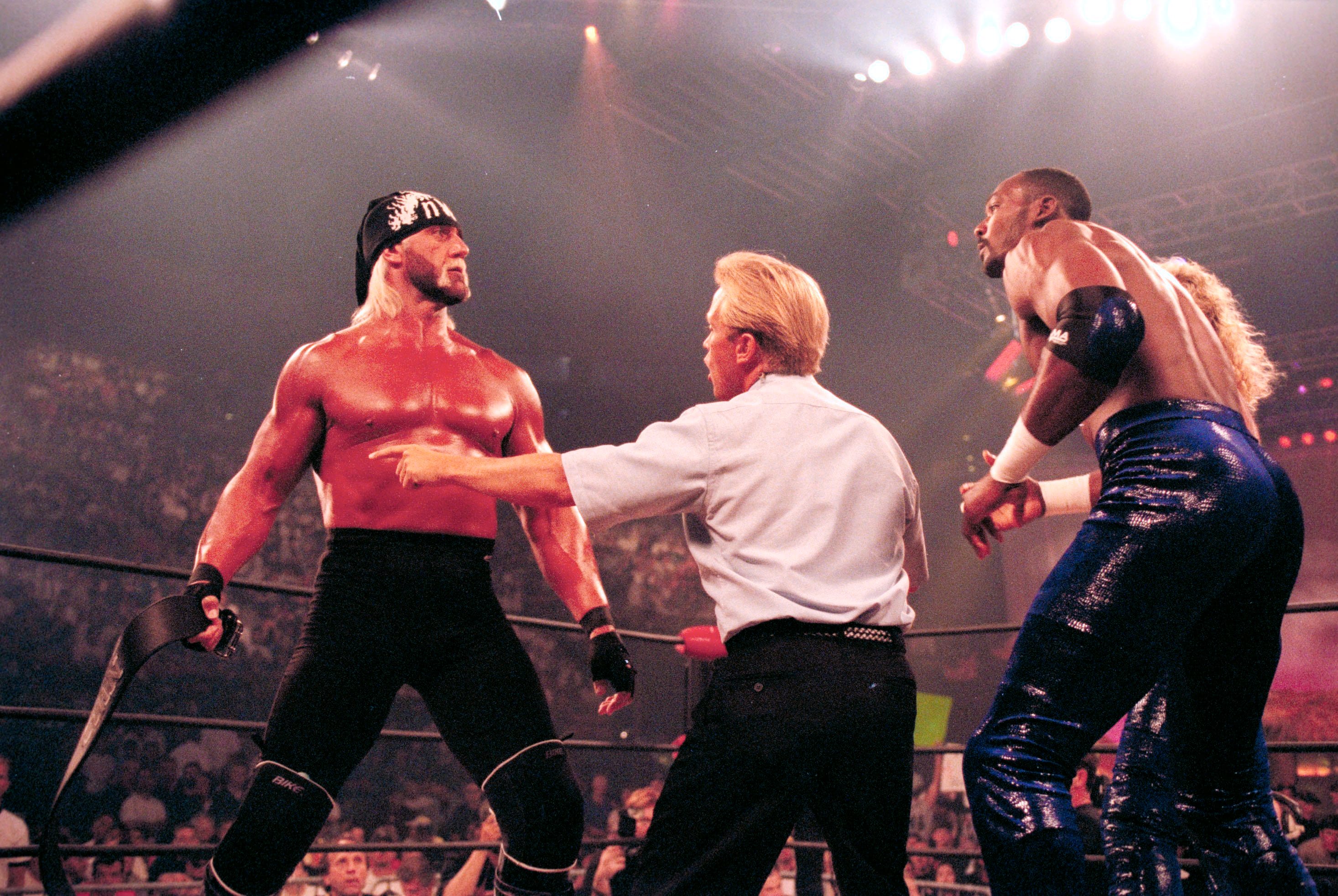 Professional Wrestling: WCW Bash at the Beach: Hulk Hogan taking off belt during match vs Karl Malone at Cox Arena.San Diego,