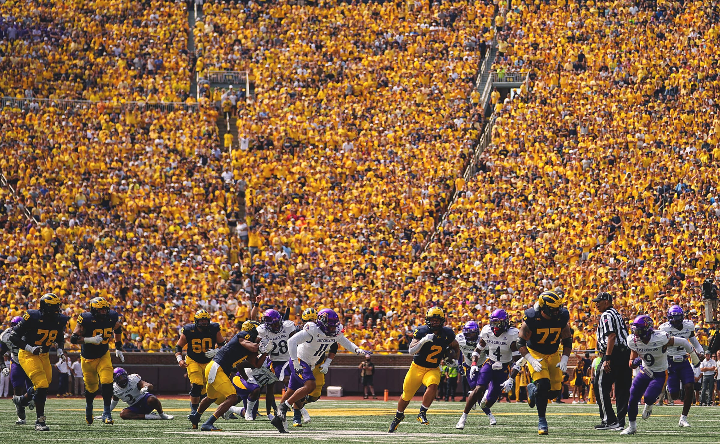 Michigan quarterback Blake Corum runs the football against East Carolina in 2023.