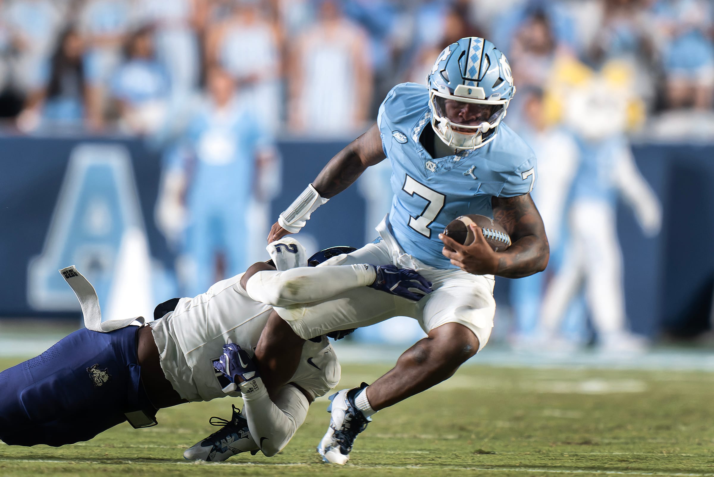 North Carolina quarterback Gio Lopez is tackled by TCU.