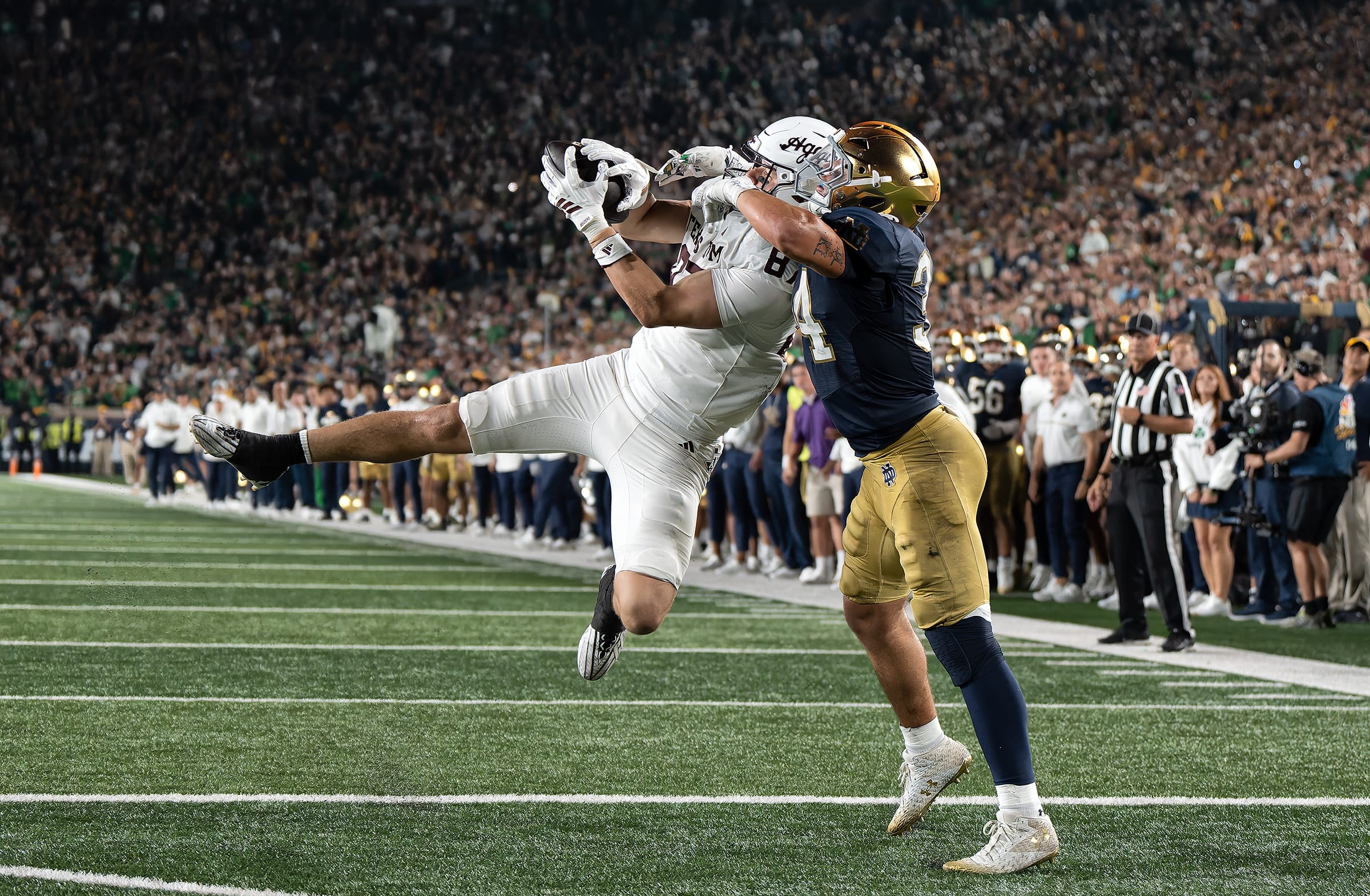 Texas A&M tight end Nate Boerkircher catches the game-winning touchdown against Notre Dame linebacker Drayk Bowen.