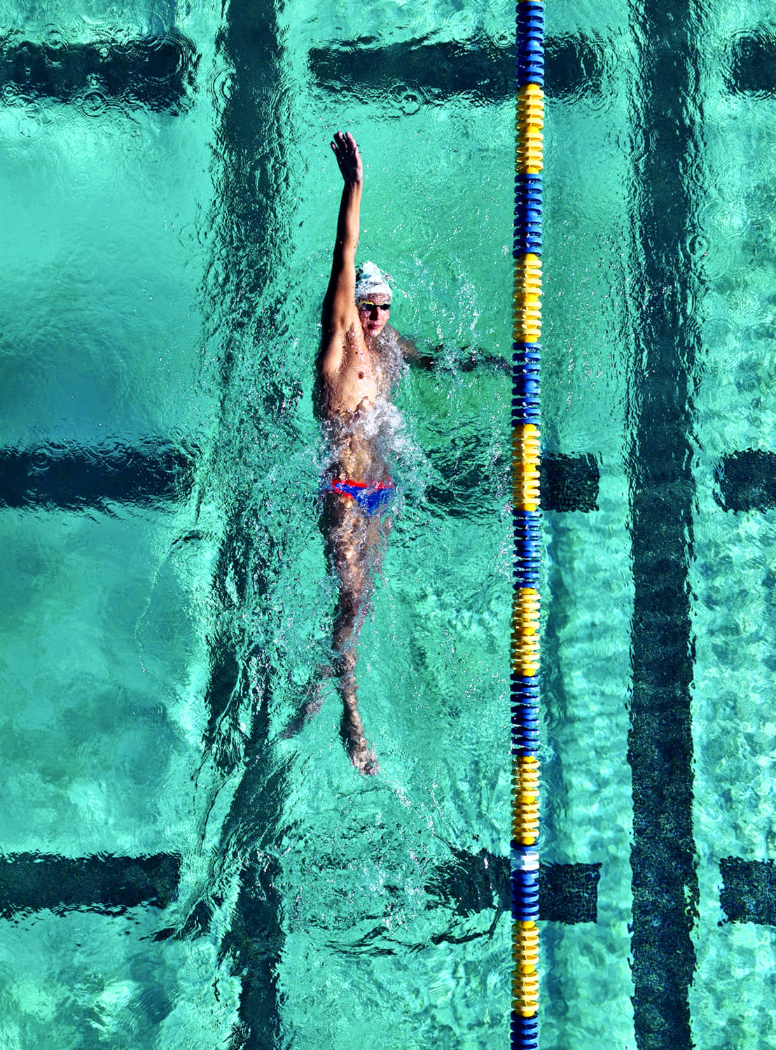 swimmer Luka Mijatovic doing a backstroke