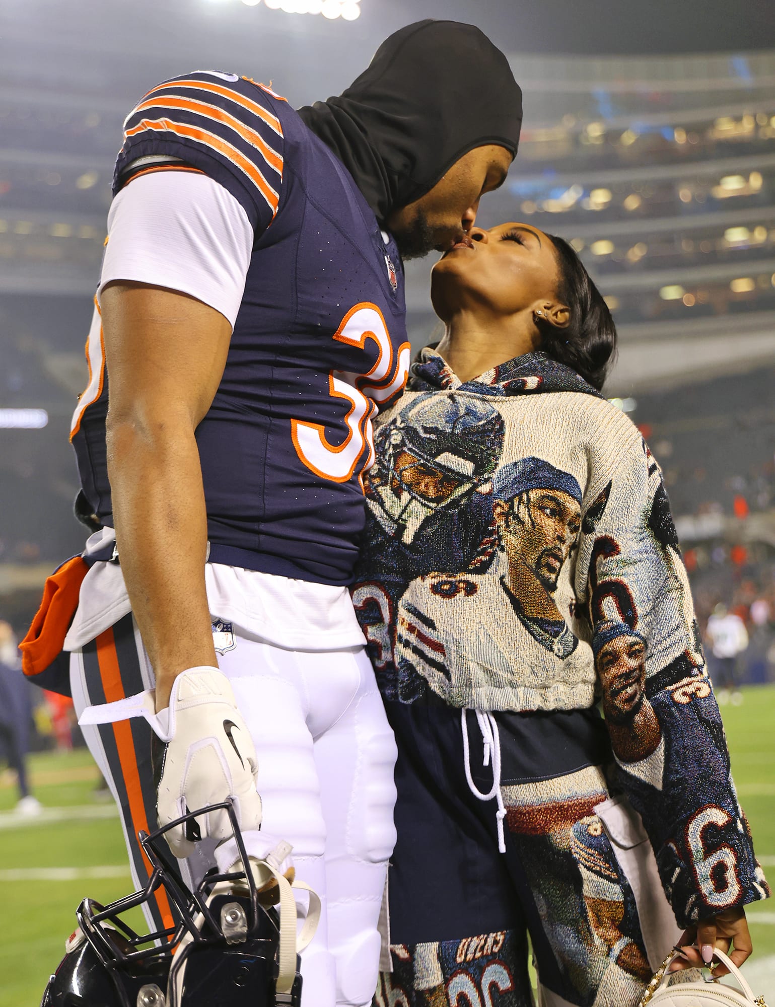Jonathan Owens of the Chicago Bears kisses his wife, gymnast Simone Biles