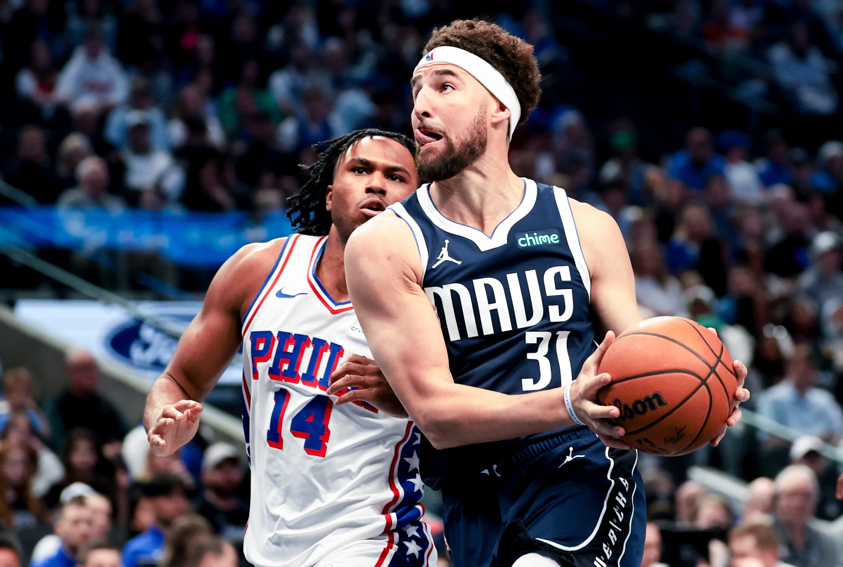Dallas Mavericks guard Klay Thompson drives to the basket as Philadelphia 76ers guard Ricky Council IV.