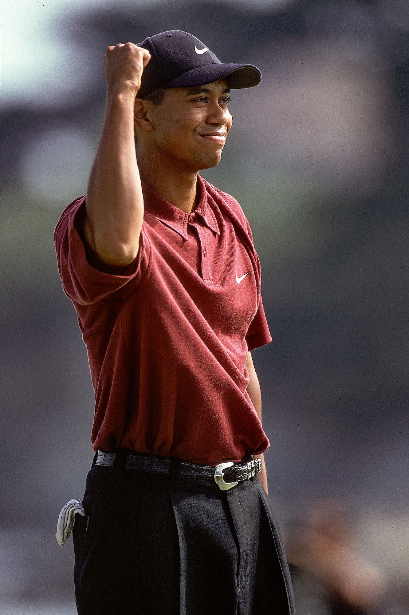 Tiger Woods celebrates with his fist in the air