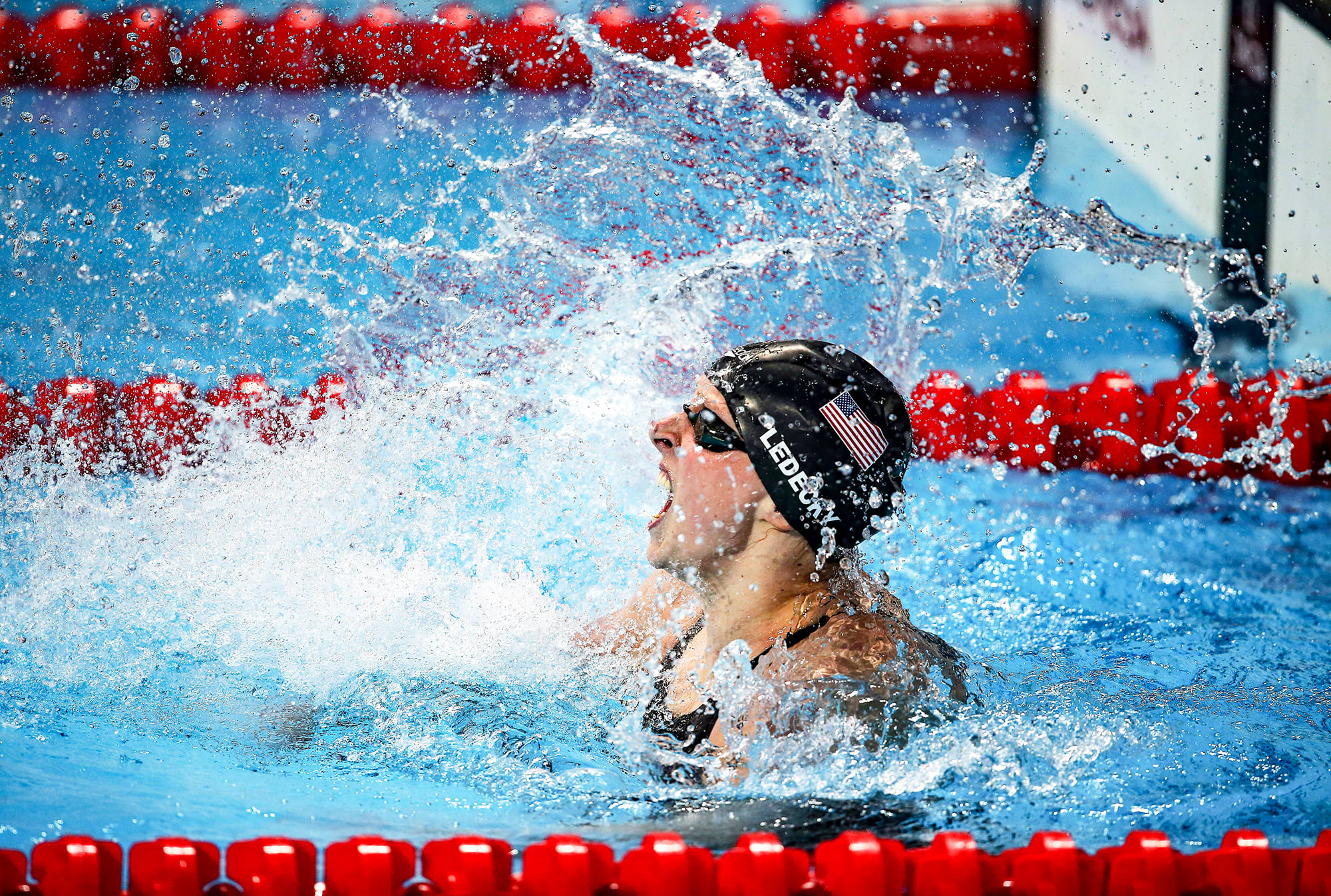 Katie Ledecky celebrates in the pool at the 2015 Worlds
