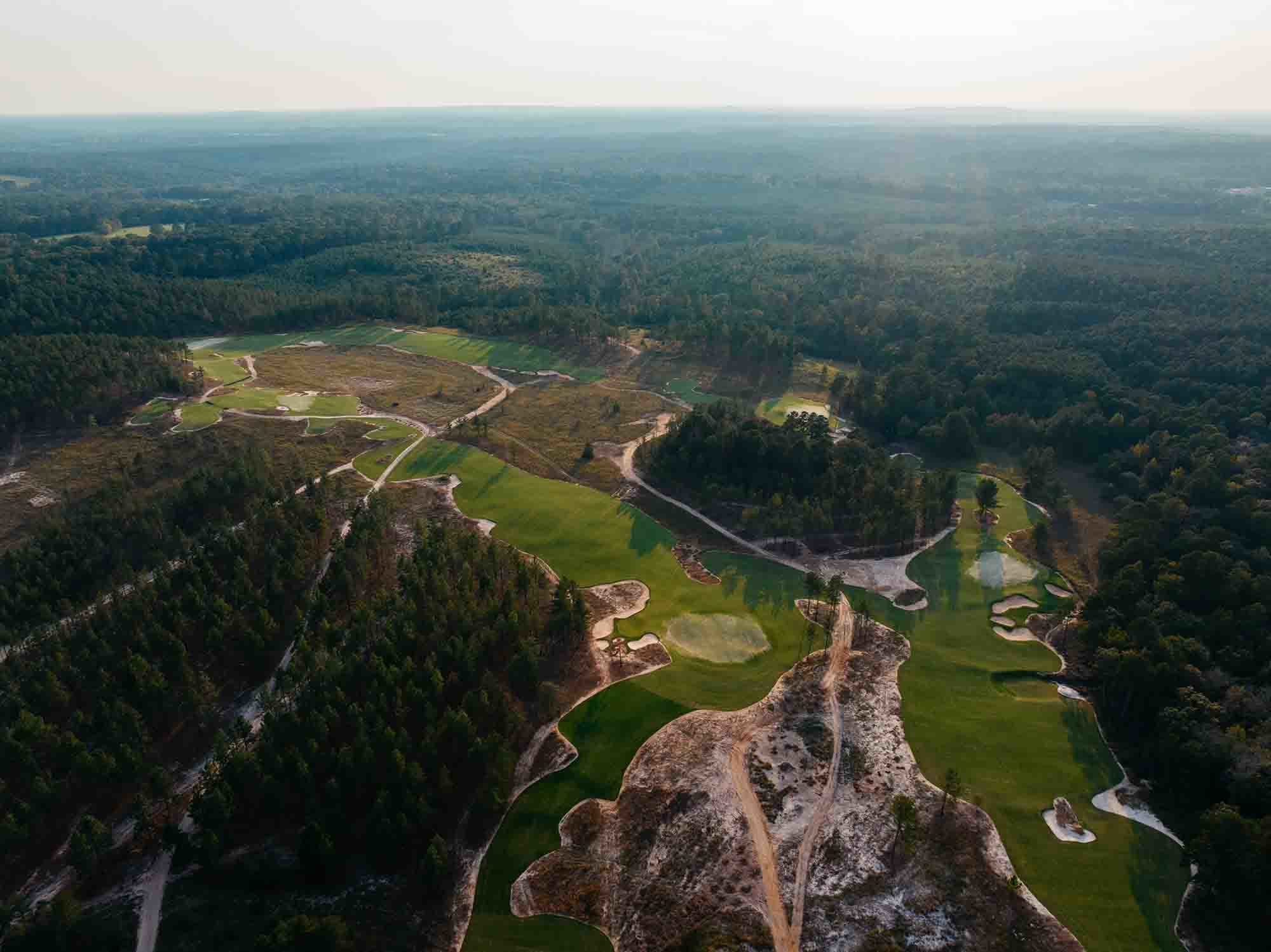 An aerial photo of the growing-in on the back nine.