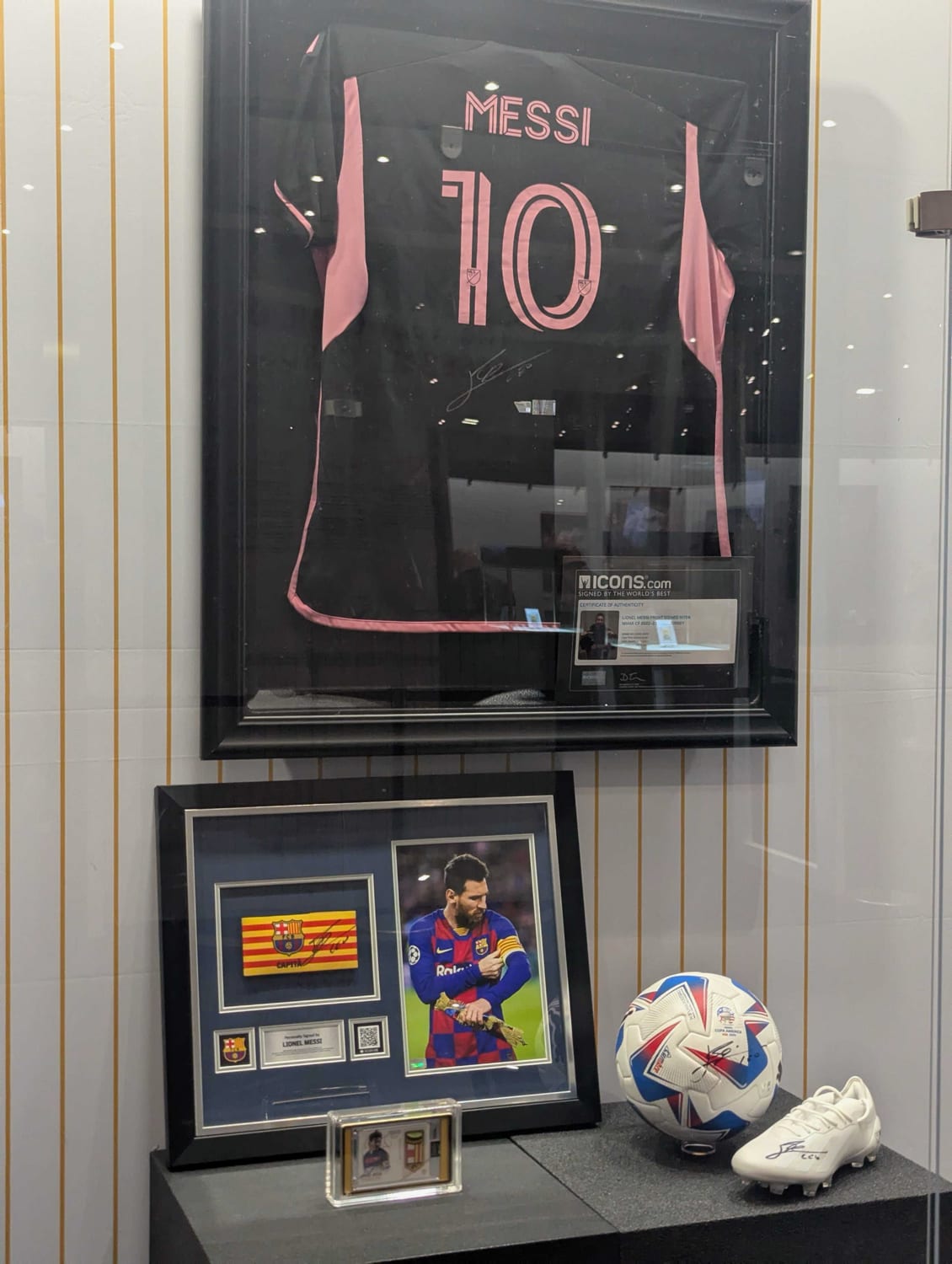 Messi collection featuring jersey, armband, ball, boots, and patch card.