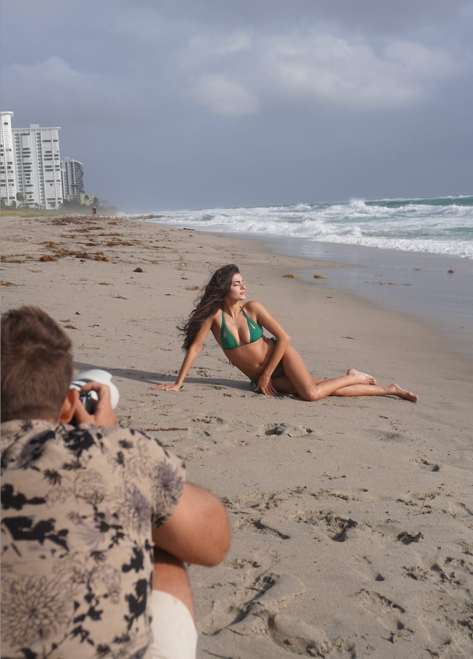 Toni Breidinger poses for Ben Horton at the Boca Raton Resort in behind the scenes photo. Swimsuit by Palmiza.
