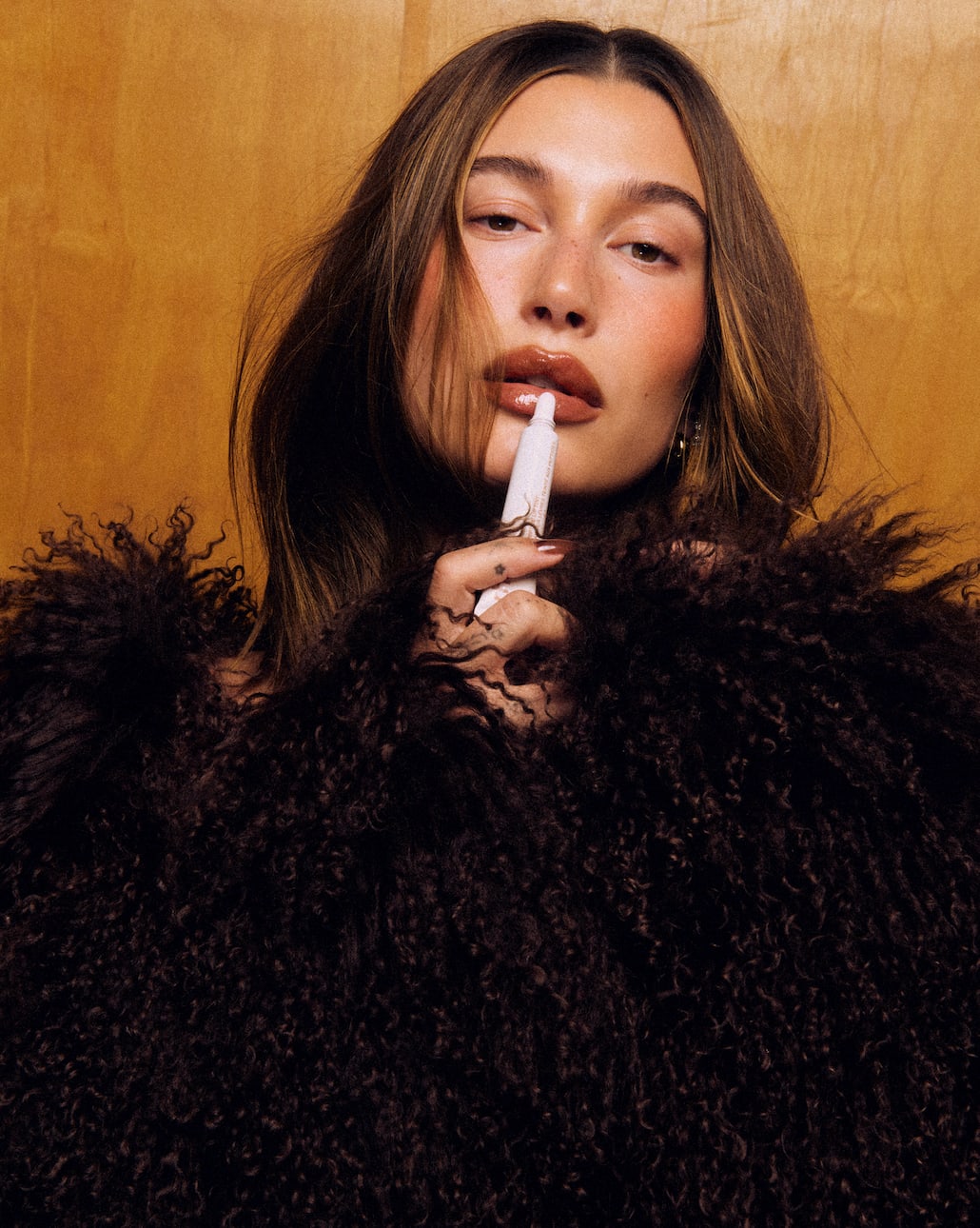 Hailey Bieber and Rhode peptide lip tint in cinnamon roll