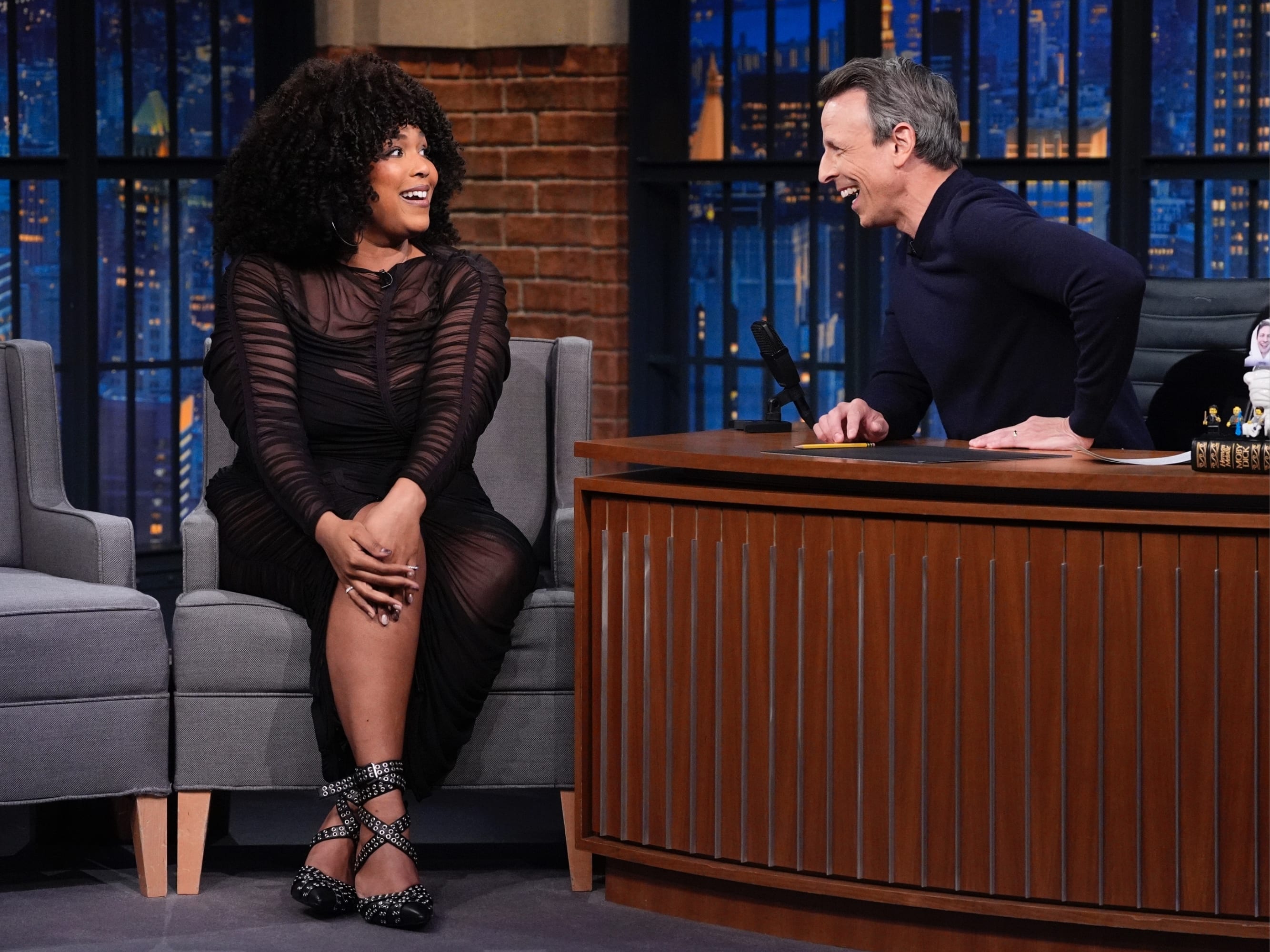 Lizzo smiles on Late Night with Seth Meyers