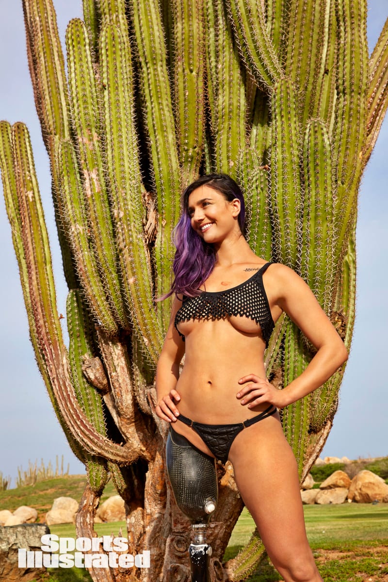Brenna Huckaby poses for SI Swimsuit in a black fishnet bikini top and lace bottoms in Aruba.