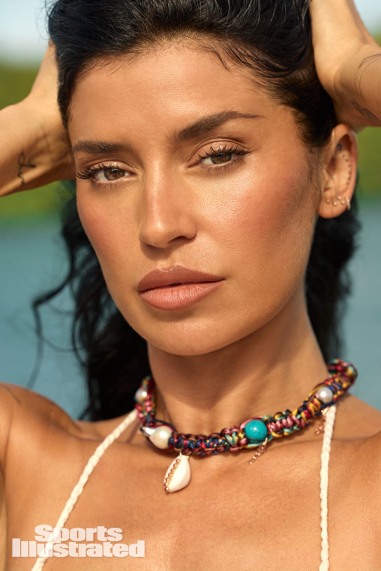 Nicole Williams English was photographed by Yu Tsai in Jamaica. Swimsuit by Akoia Swim. Necklace by Joie DiGiovanni.