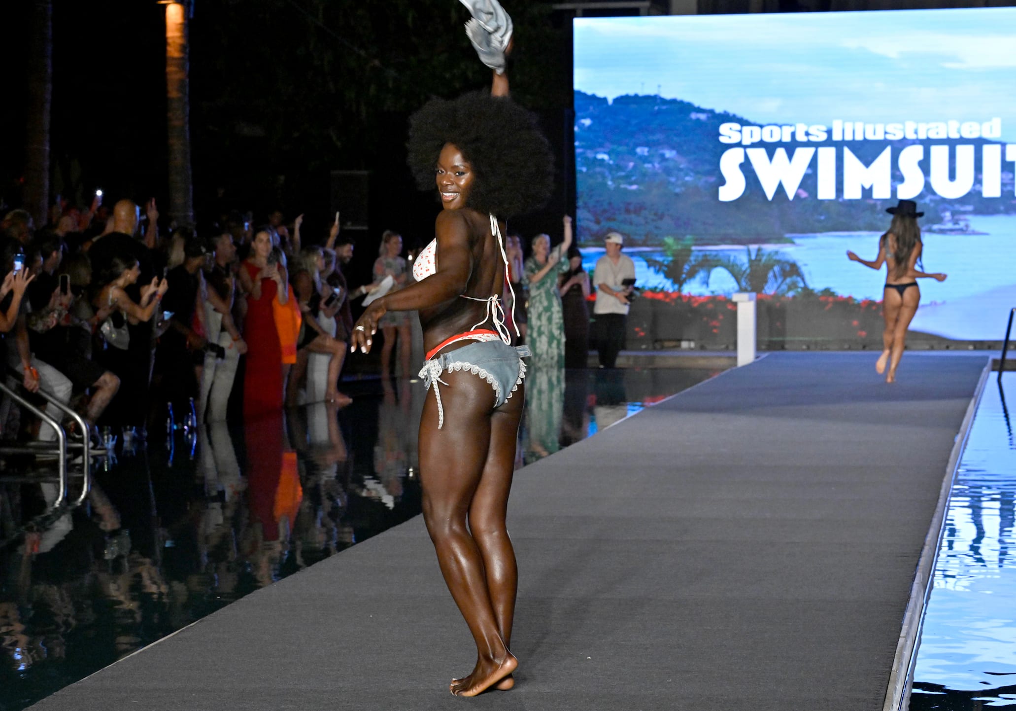 Tunde Oyeneyin walks the runway at the Sports Illustrated Swimsuit Runway Show