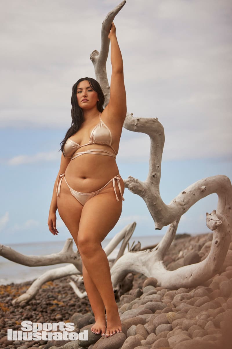 Yumi Nu poses in a bikini on the rocks in Dominica.