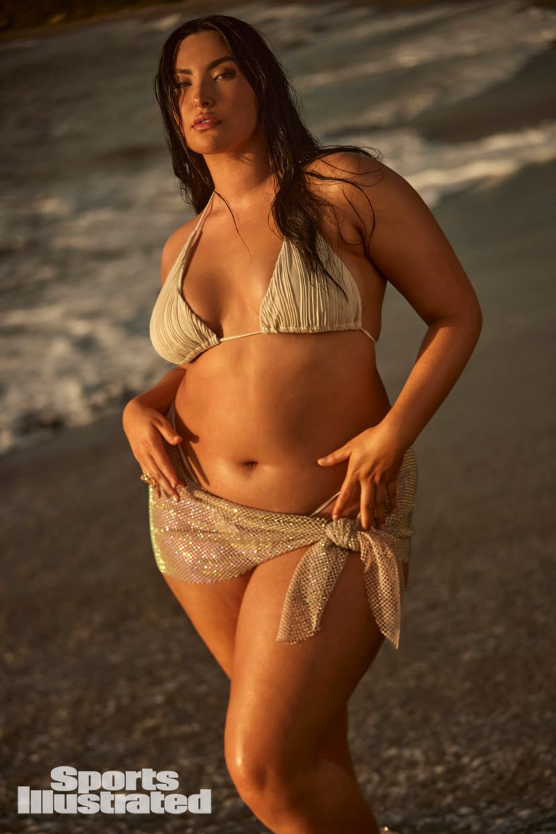 Yumi Nu poses in a bikini and cover-up skirt on the beaches of Dominica.