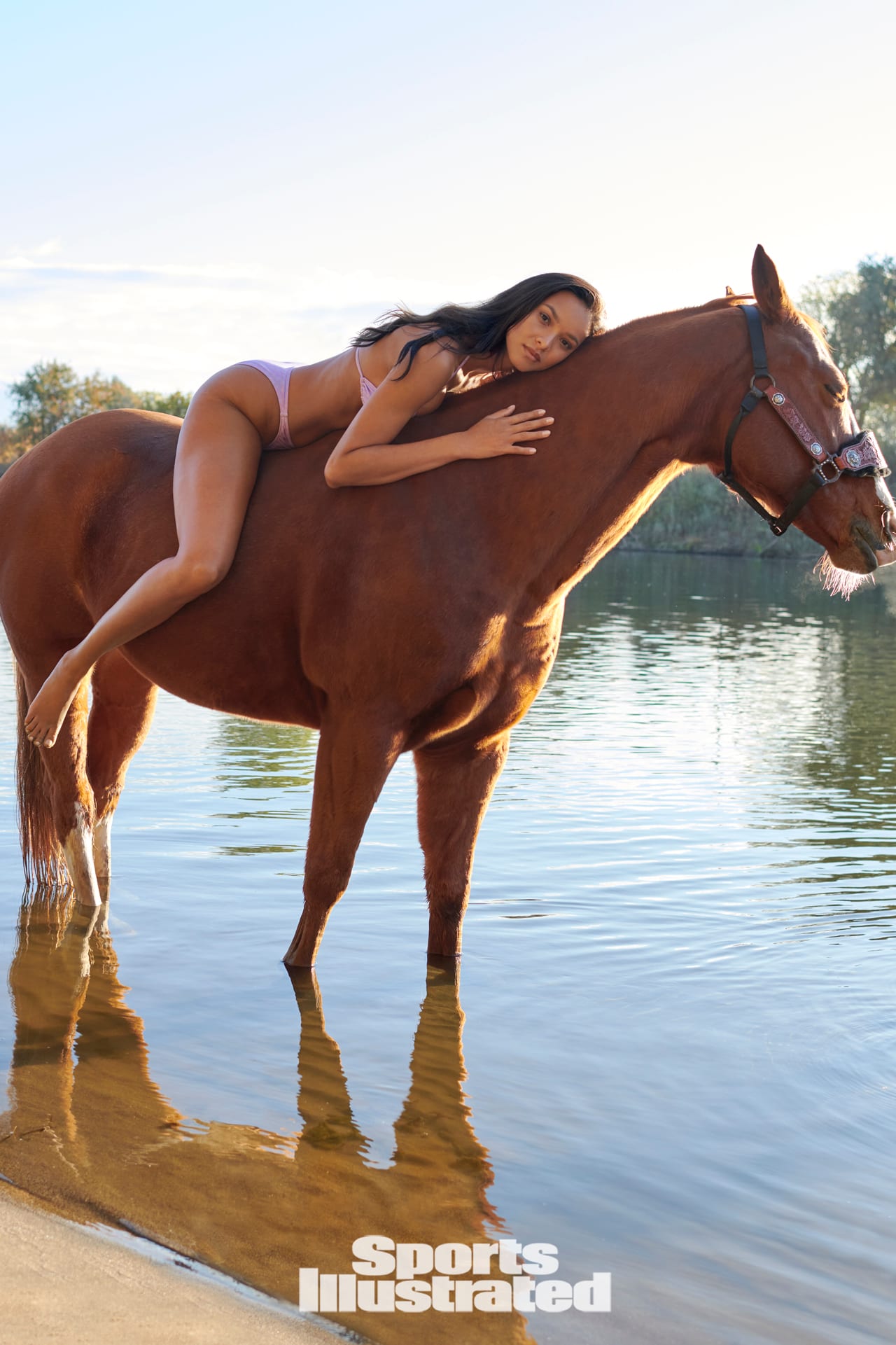 Lais Ribeiro poses in a pink bikini on top of a horse in Sacramento.