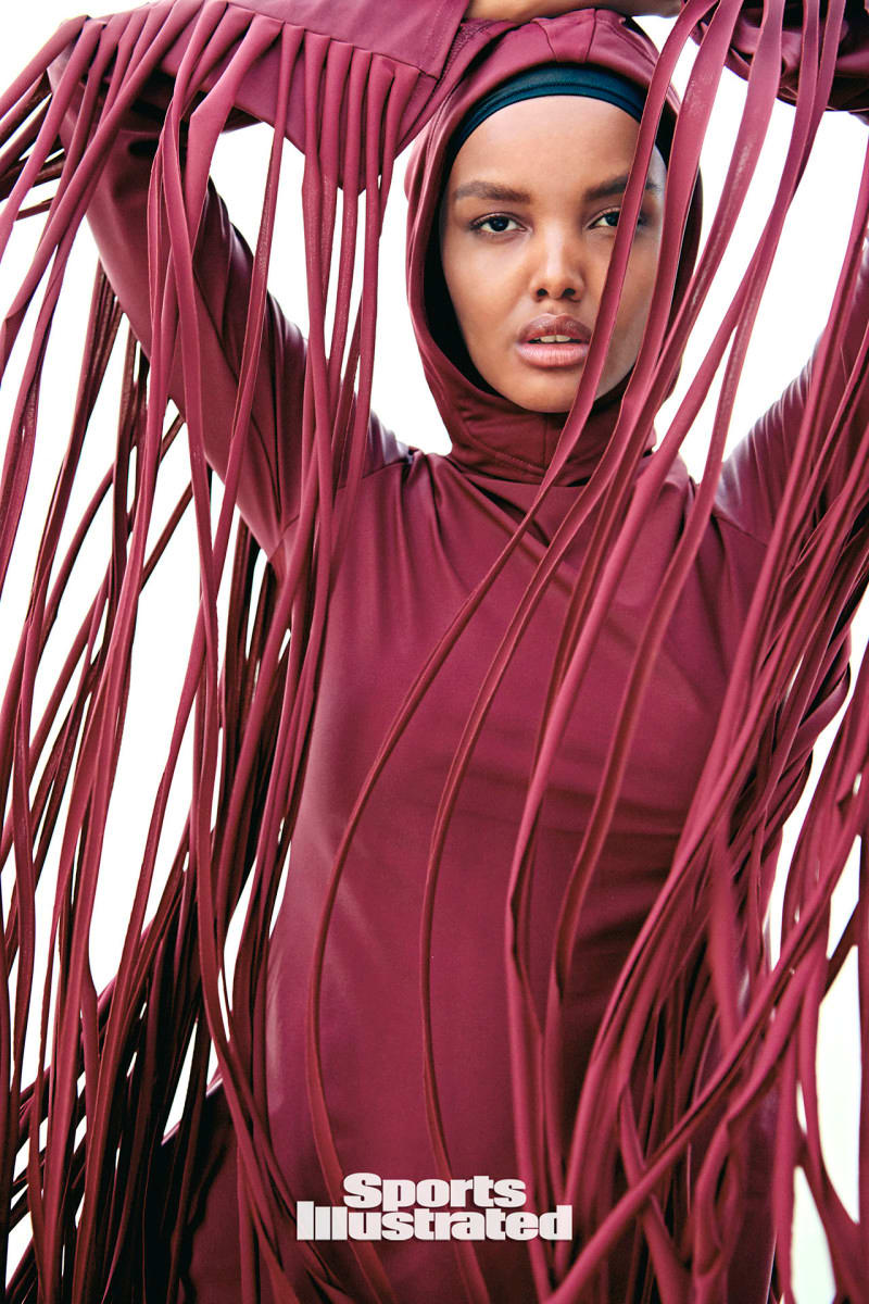 Halima Aden is wearing a wine red swimsuit with tassels in the Dominican Republic.