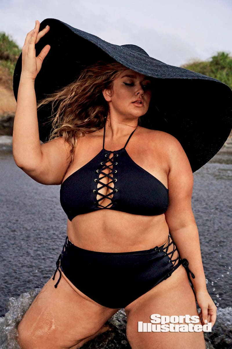 Hunter McGrady is wearing a black bikini and black hat in Bali.