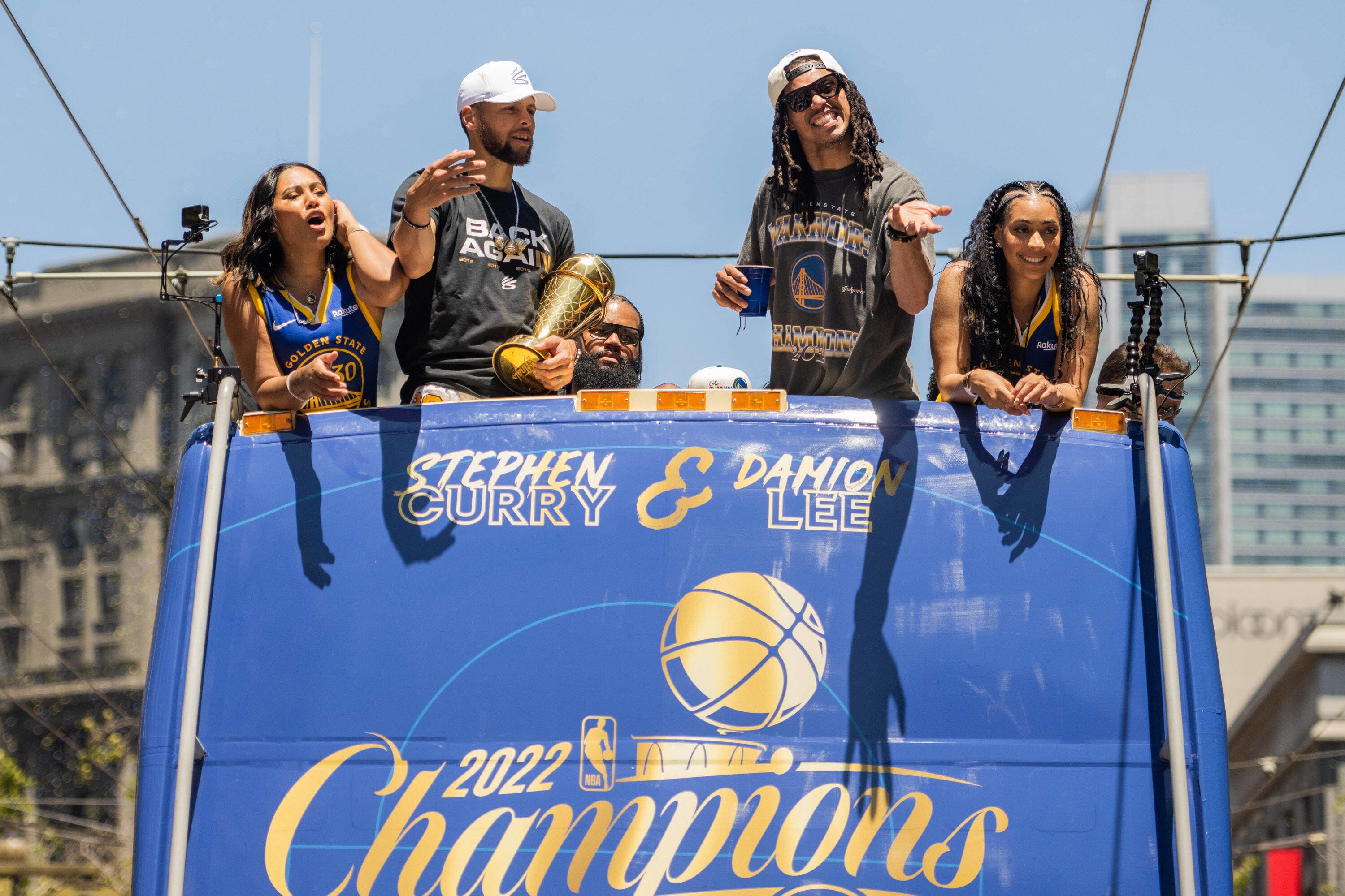 Ayesha Curry, Steph Curry, Damion Lee and Sydel Curry celebrate on a float during the Golden State Warriors Championship Para