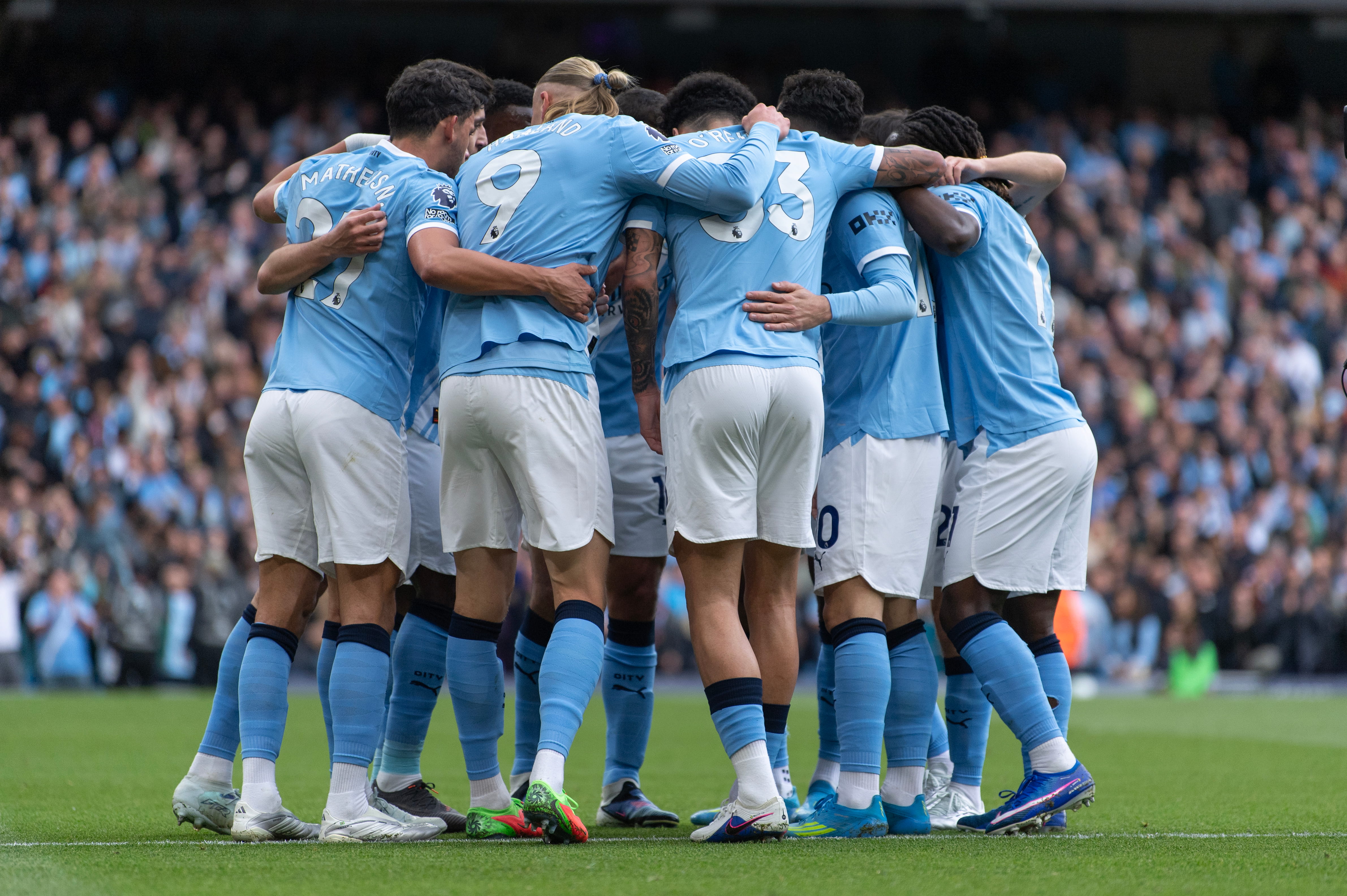 Manchester City players in sky blue kits