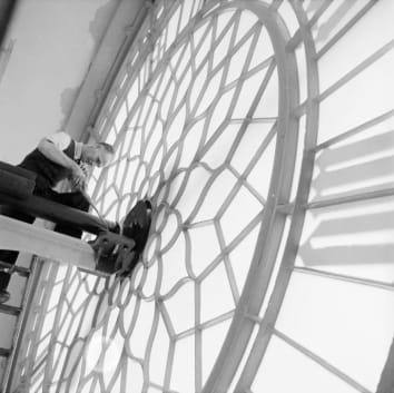 A clockkeeper works on London's Big Ben in 1957.