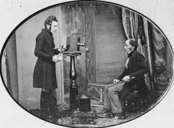 Jabcz Hogg photographing W S Johnston in the first known image of a photographer at work, circa 1843.