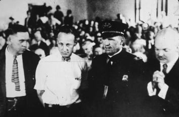 John Thomas Scopes (second from left) in the courtroom during his trial for teaching Darwin's Theory of Evolution in his high school science class.