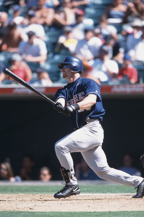 Phil Nevin follows the flight of his batted ball