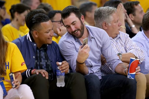 Justin Verlander and Miguel Cabrera sitting courtside at Oracle Arena during the 2015 Western Conference Finals