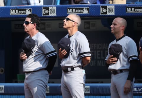 Rob Thompson (Left), Joe Girardi (Middle), and Joe Espada (Right) during the New York Yankees v Toronto Blue Jays