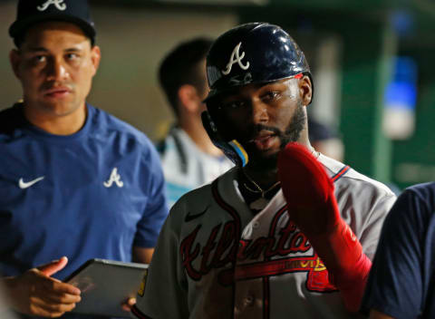 Michael Harris II of the Atlanta Braves shows off his new red oven  mitt. 