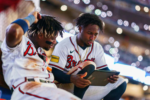 Ozzie Albies reads Bram Stoker's Dracula out loud to Acuna during the 7th inning stretch. Knowledge is power.