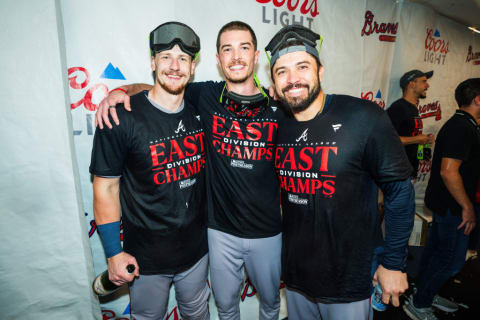 Travis d'Arnaud, Sean Murphy, and Max Fried celebrate the Atlanta Braves 2023 NL East title. 