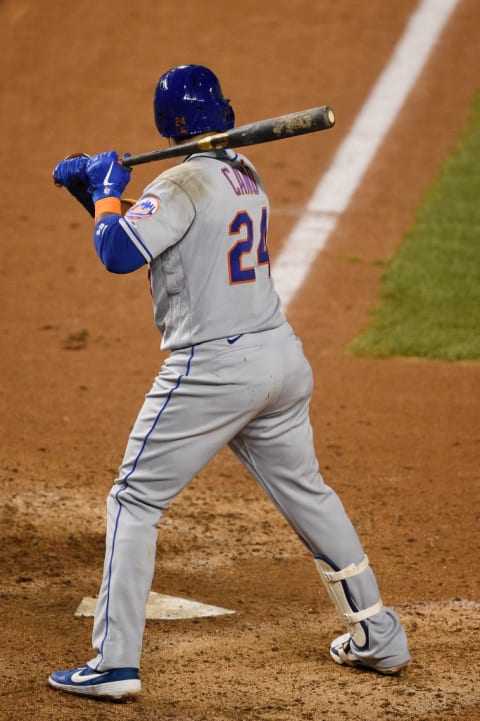 Robinson Cano bats in a game against the Washington Nationals.