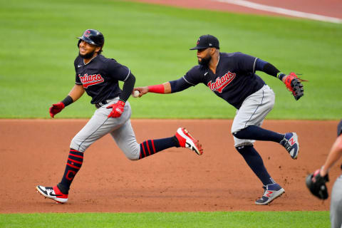 Carlos Santana tags out George Valera at a 2020 Spring Training game. 