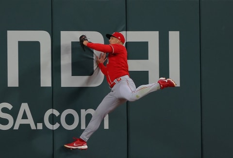 Cincinnati Reds outfielder Nick Senzel makes the catch.