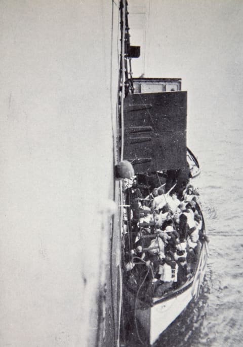 View from the 'Carpathia' of a lifeboat from the 'Titanic' brought alongside.