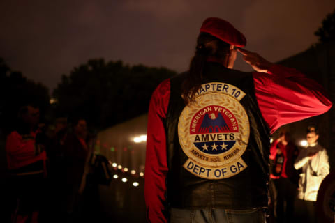 Veterans are honored at a candlelight vigil at the Vietnam Veterans Memorial.