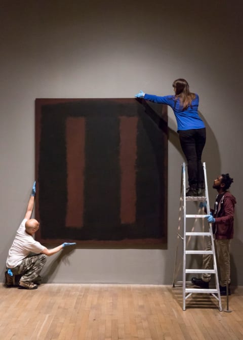 'Black on Maroon' by Mark Rothko being put back on display after restoration.