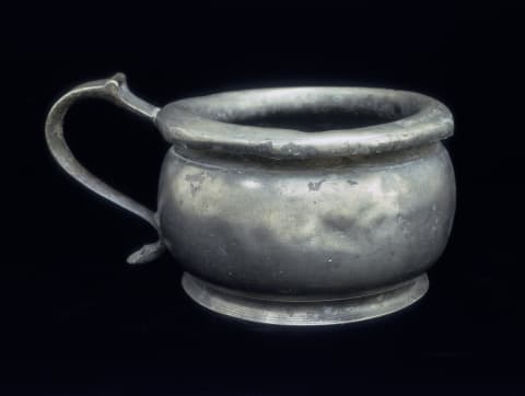 A pewter chamber pot from the 18th century.