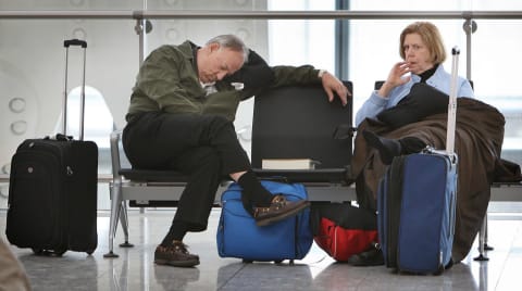 A man sleeping at Heathrow Terminal 5.