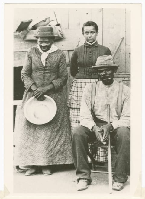 Tubman, husband Nelson Davis, and their adopted daughter Gertie on their porch in Auburn, New York, circa 1880s.