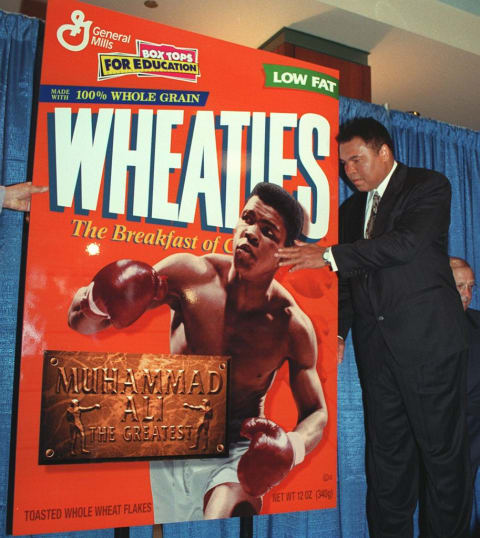 Ali celebrates his Wheaties box.