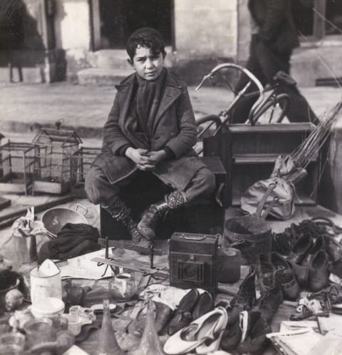 A flea market in Paris, circa 1950.