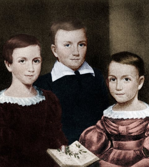 Emily Dickinson with siblings Austin and Lavinia.