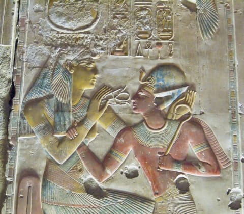 Pharaoh Seti I (on right) with the Goddess Hathor, circa 1290 BCE from the temple of Seti I in Abydos. 