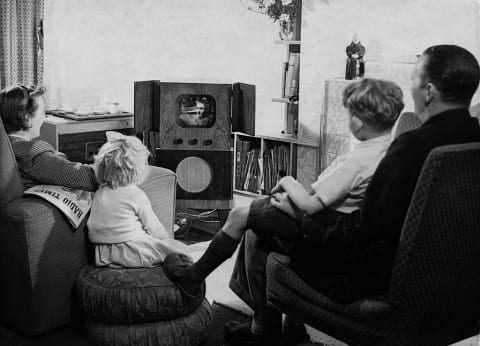 Family watching television circa the 1950s.