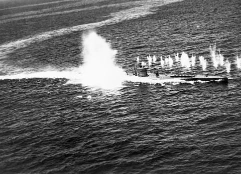 A depth charge exploding near a U-boat.