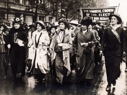 Emmeline Pankhurst (center) leads a march.